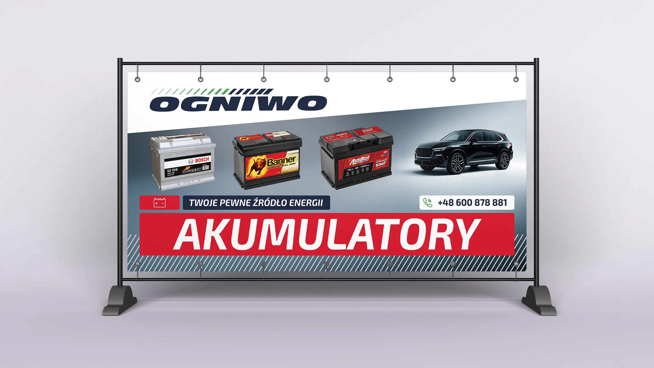 Zewnętrzny baner reklamowy Ogniwo Minus z akumulatorami Bosch, Banner i Autopart oraz hasłem „Akumulatory” i numerem telefonu kontaktowego.