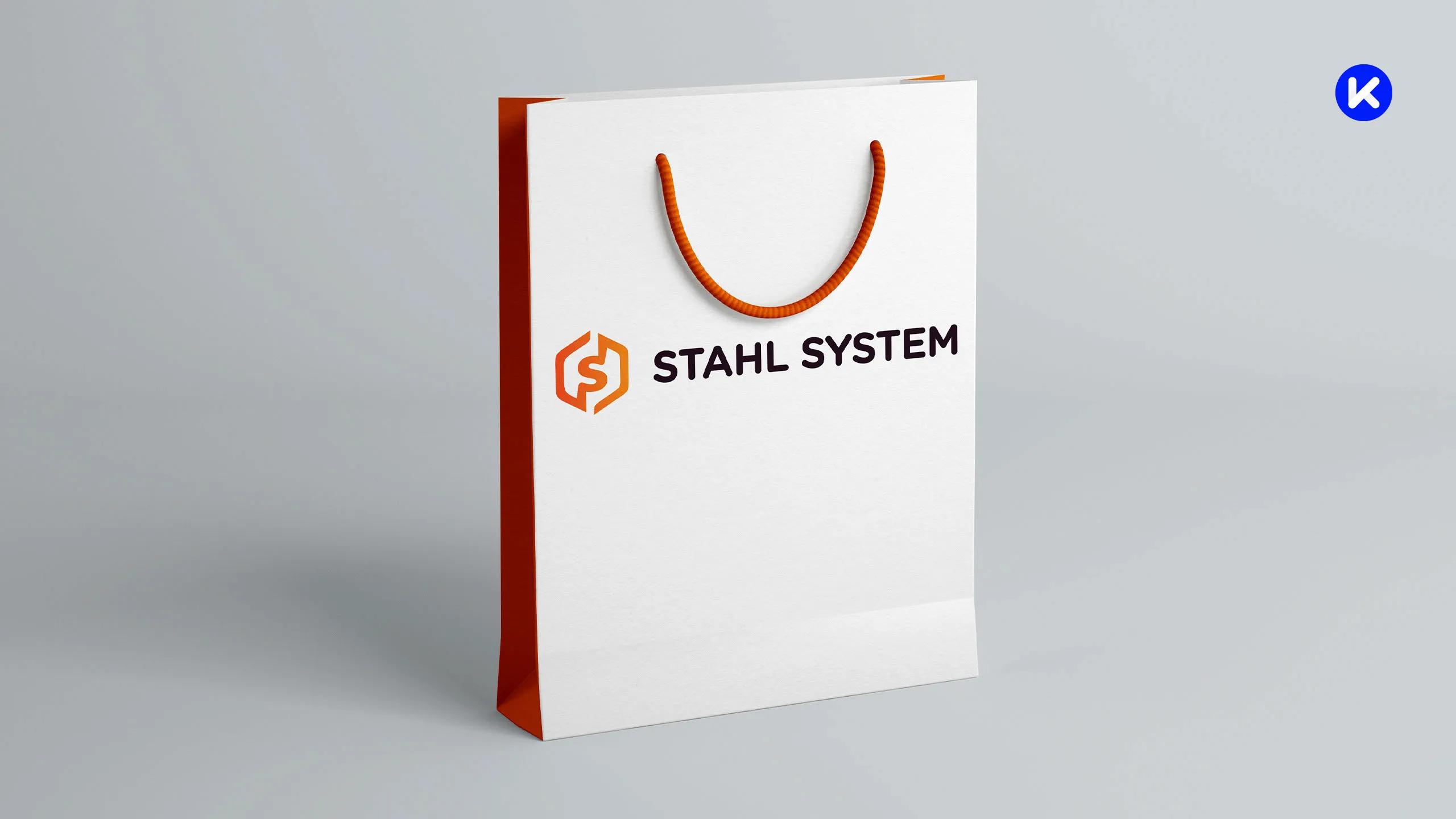 Biała torba papierowa Stahl System z pomarańczowym bokiem i nadrukowanym logo producenta